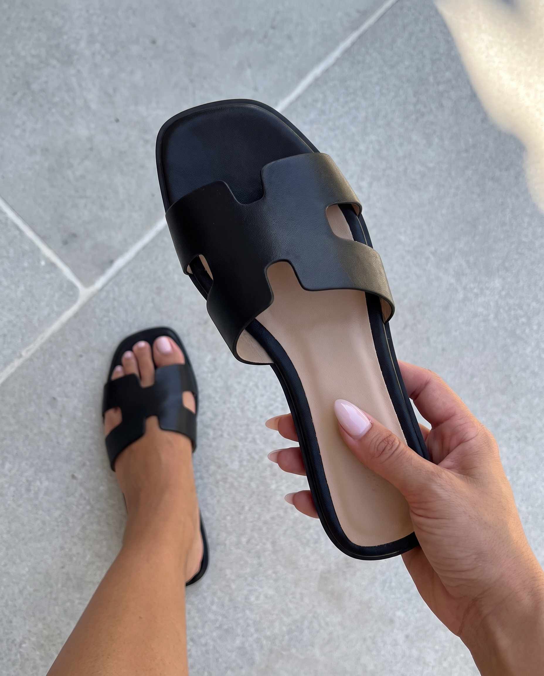 Lacta Sandals Black worn on foot, real-life lifestyle photo