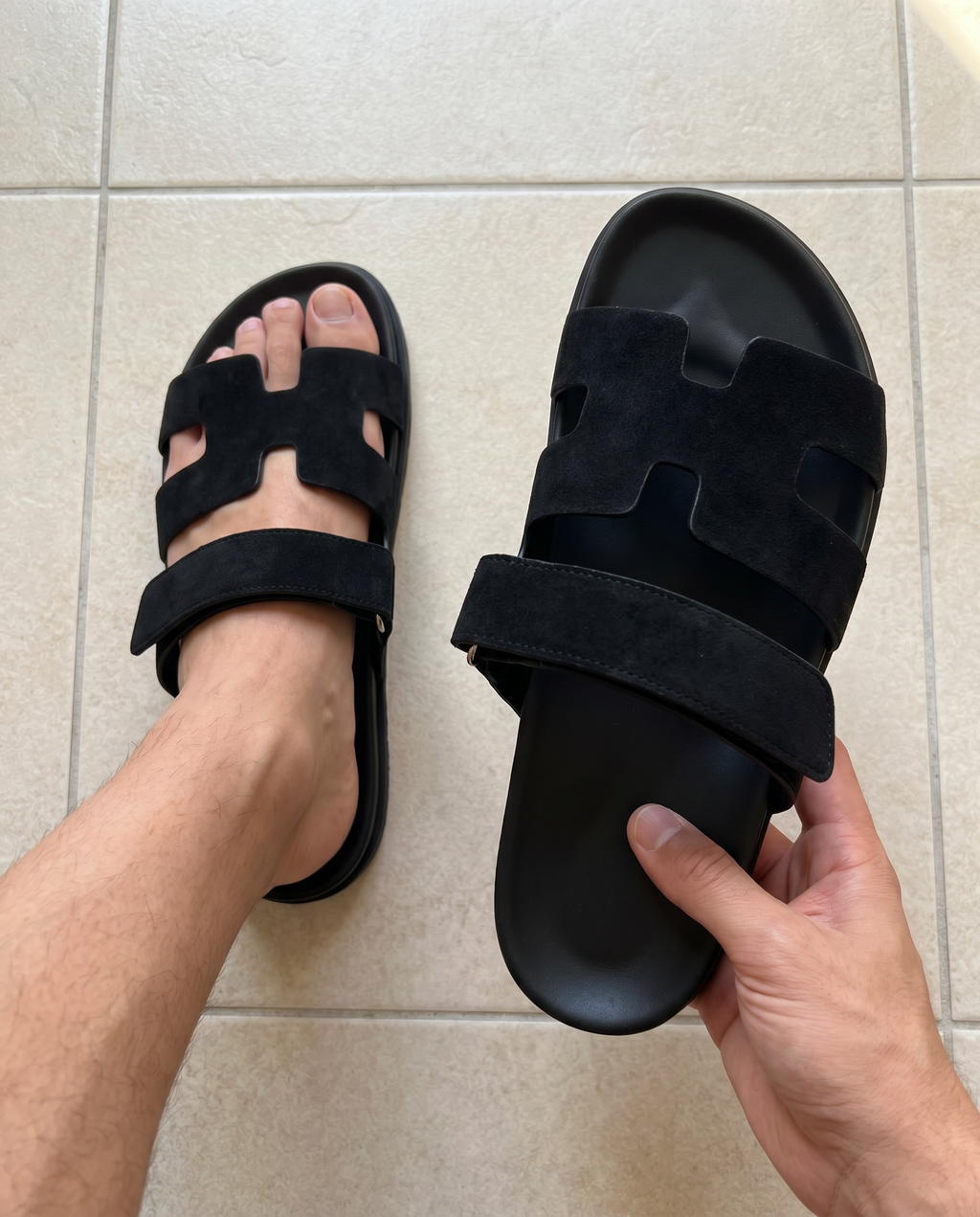 Lacta Slides Black worn on foot, real-life lifestyle photo